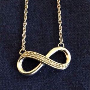 Sterling silver infinity necklace set with diamond